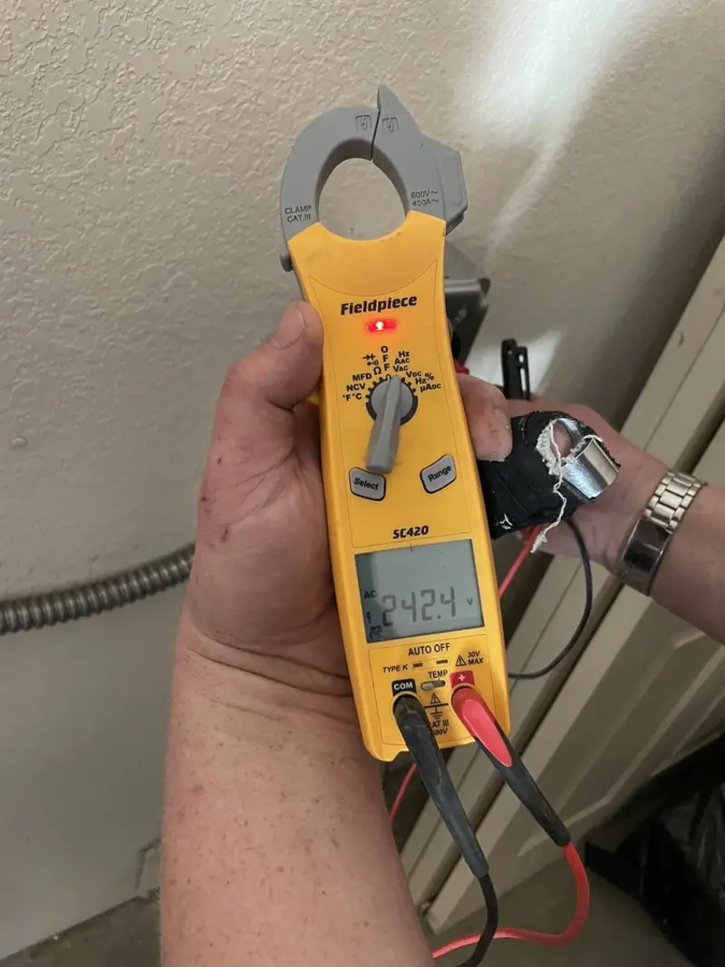 Voltage testing with clamp meter during Outlet Installation in Pittsboro